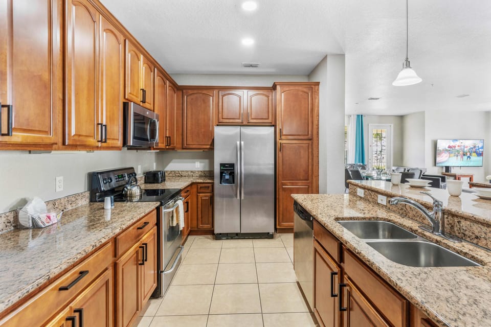 Start your day right in our fully equipped kitchen featuring a convenient breakfast bar. From morning coffee to hearty breakfasts, this space is designed for culinary delights and shared moments.