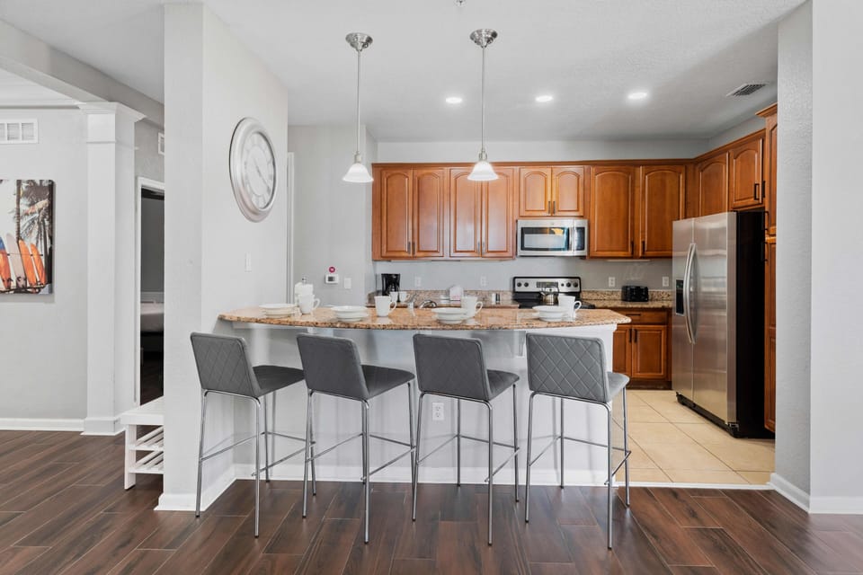 The breakfast bar offers a cozy spot for casual dining or enjoying a quick bite, making it the heart of the home.