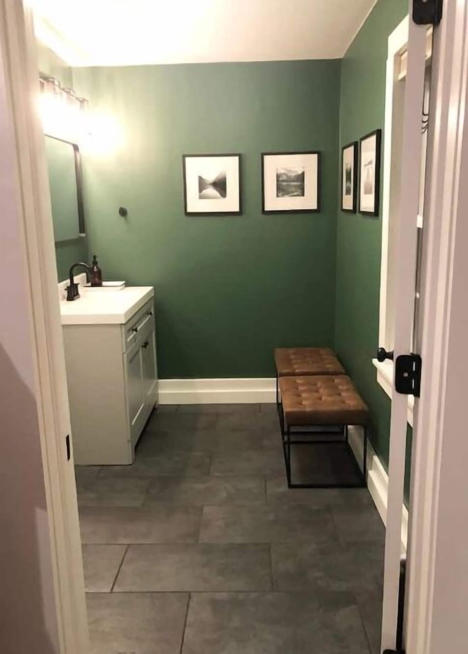 Upstairs bathroom has 2 rooms with 2 sinks. This is the "changing room" side. 