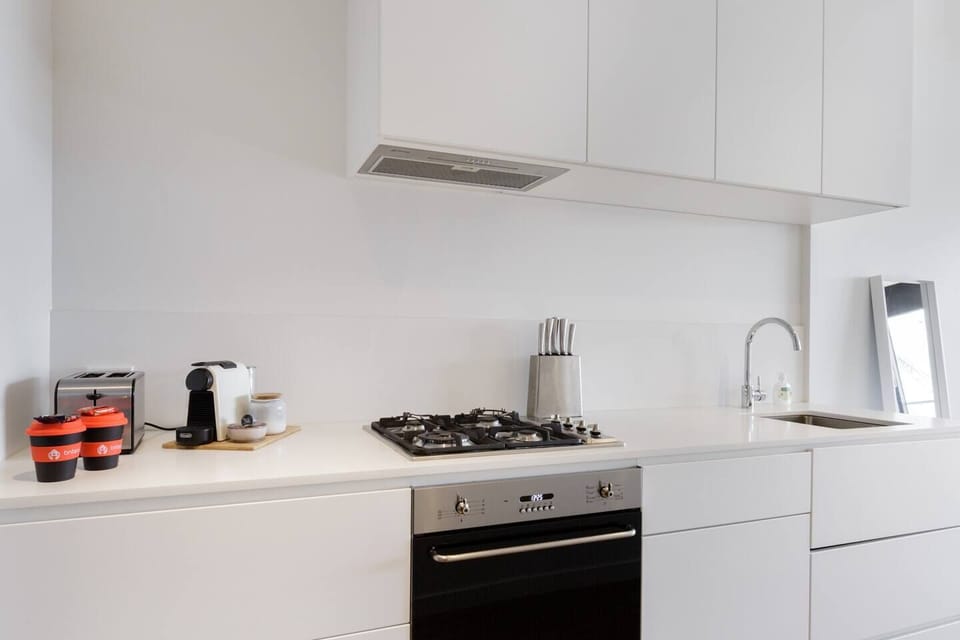 Step into the full kitchen, equipped with modern appliances, perfect for preparing your favourite home-cooked meals during your stay.