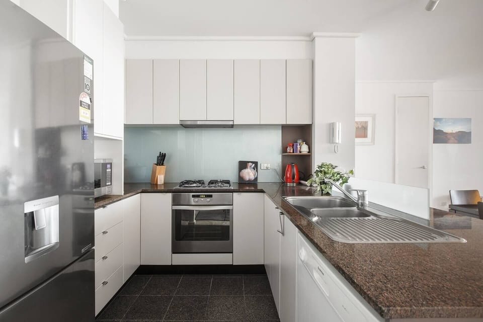 The fully-equipped kitchen is spacious and has all the appliances you'll need to whip up a meal at home.