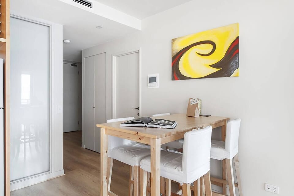 A four-person dining table in the living area allows guests the space to come together for a shared meal. There are also abundant restaurants and eateries nearby.
