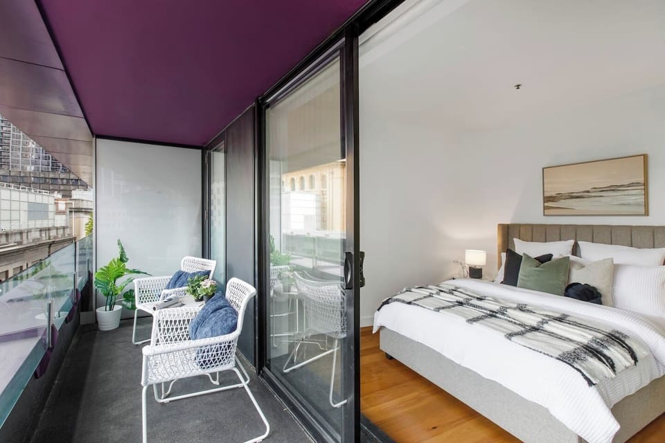 Wake up to city views from the plush queen bed of the second bedroom.
