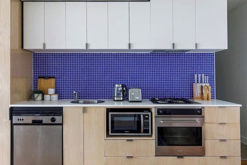 This fully furnished kitchen is cleverly designed to offer you everything you’ll need in one cozy space.