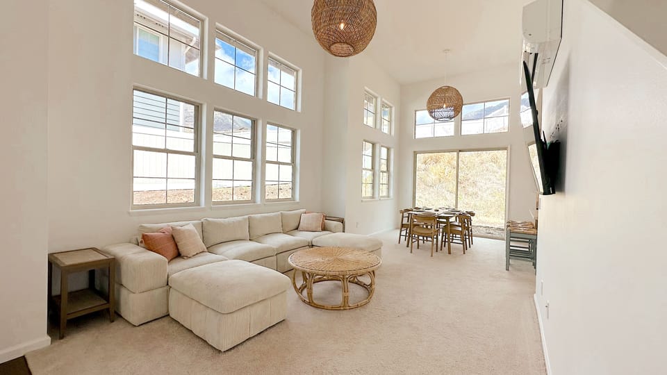 Clean and comfortable living space! The living room leads into the kitchen.