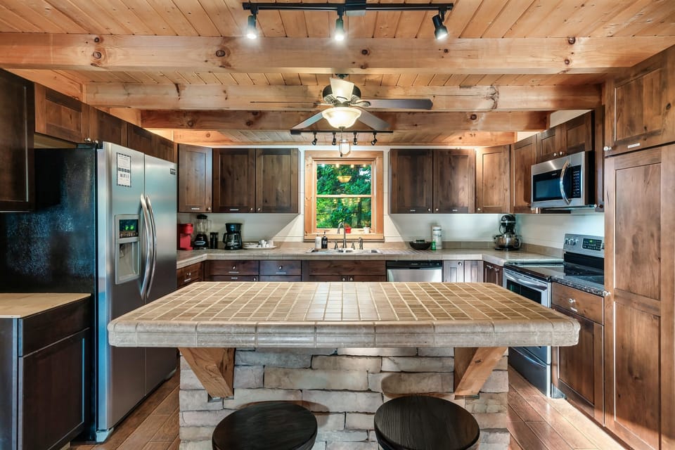 Plenty of fridge space, storage, pots and pans, seating in the kitchen