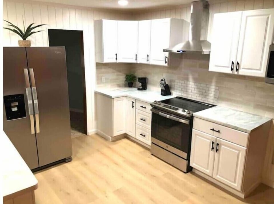 Full-sized stainless Kitchen appliances. 