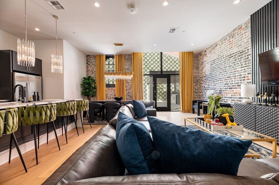 Living Room opens up to pool. Features queen-size sleeper sofa.