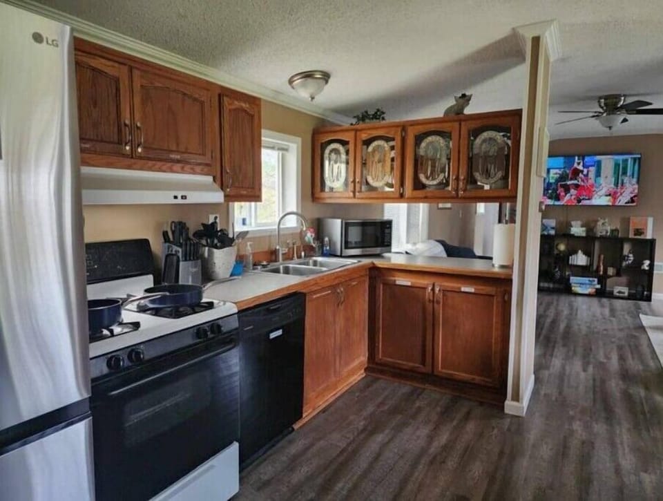 A Full Kitchen ready for you and Round ice cubes in Freezer.  