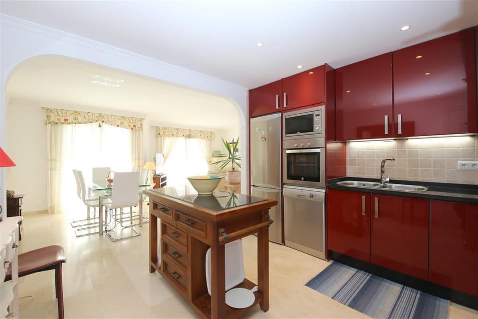 Kitchen and lounge view from the apartment entrance
