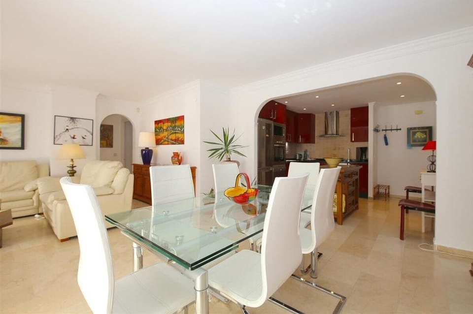 Modern dining area for six guests on a side of the lounge