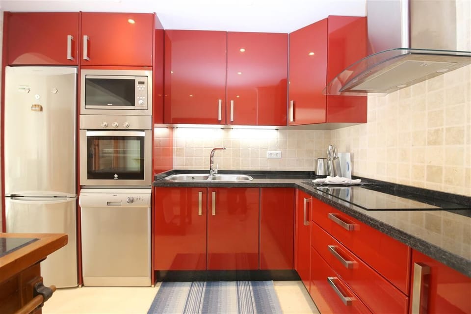 Another view of the modern open kitchen in this property