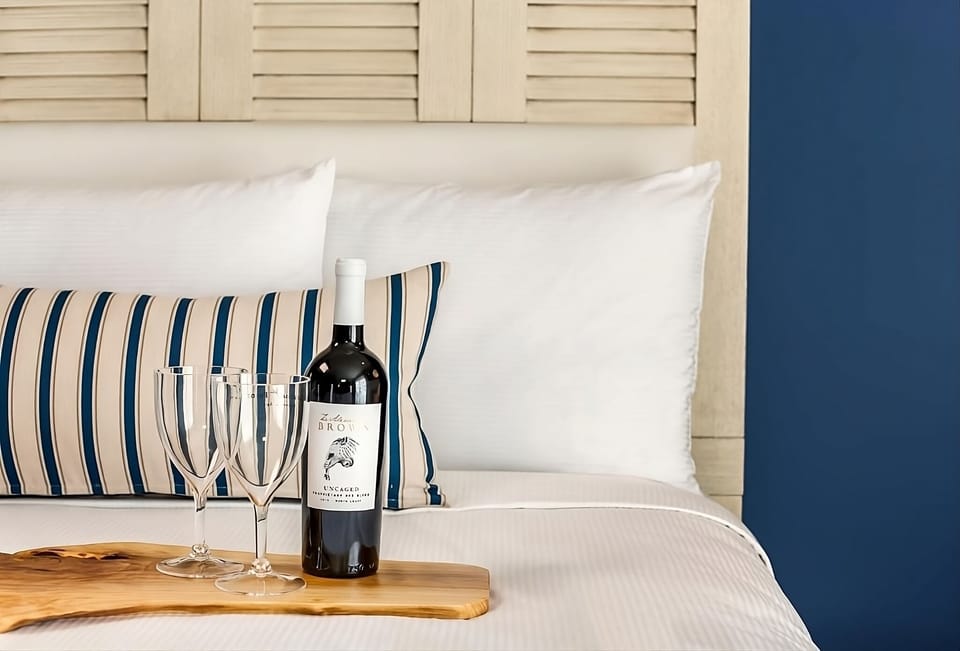 Savor a welcome toast in crisp, hotel-soft bedding.