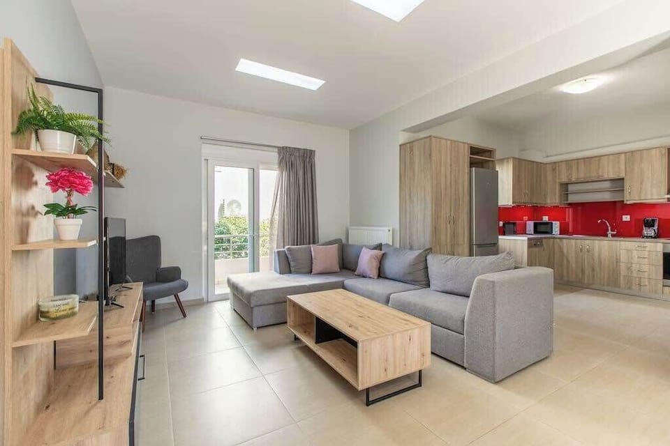 Bright Living Space with Sofa, Kitchen & Balcony