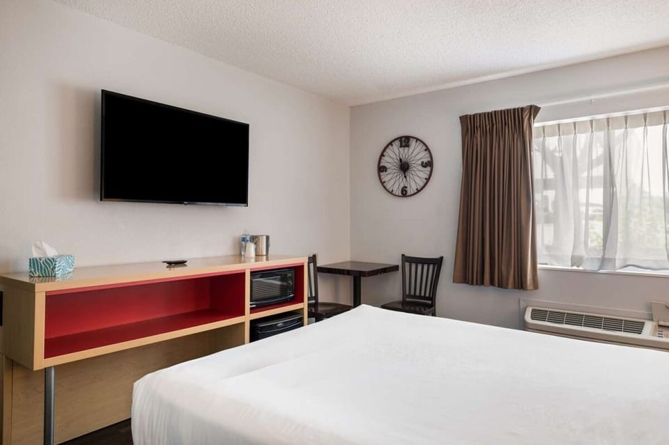 Relax after a long day with TV, fridge, and microwave nearby