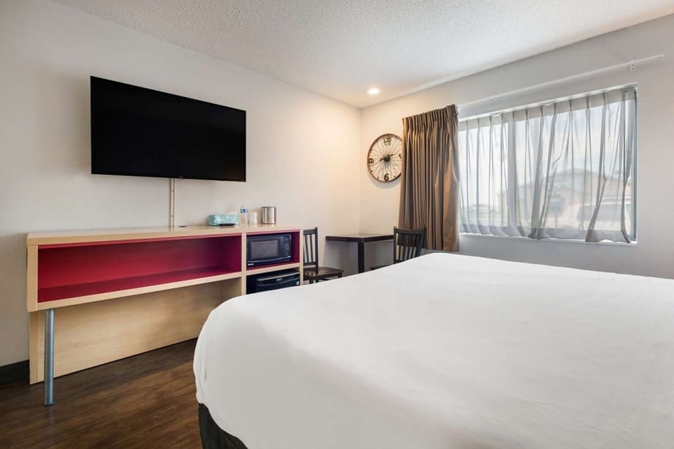 Sink into a smooth, spacious bed with big-screen entertainment.