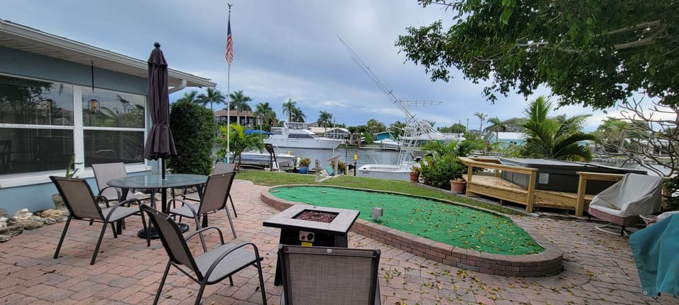 Firepit, putting green, hot tub and on the river!!