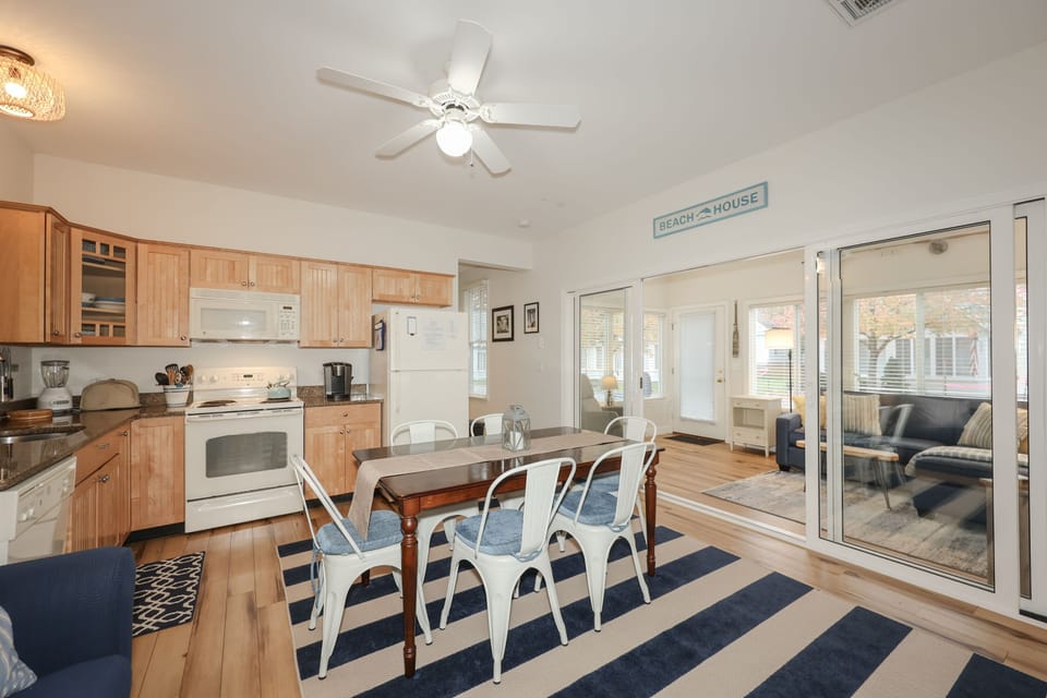 View of kitchen and sun room from living room