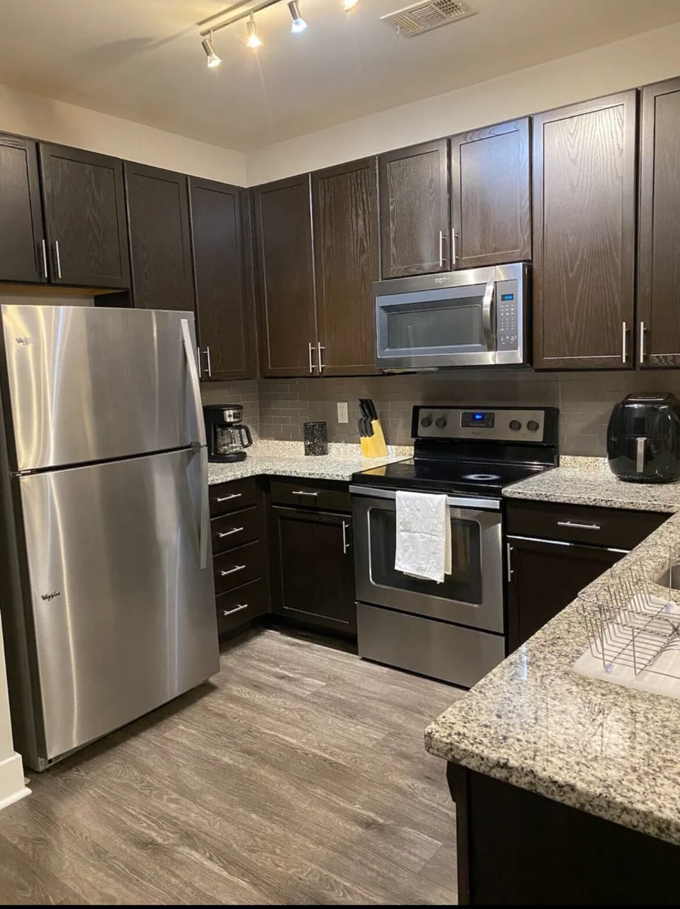 Full size fridge, oven,  and microwave. Air fryer for some quick home-meals.