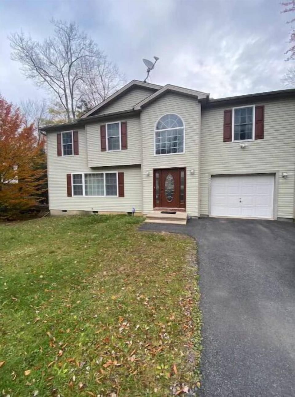 Large back and front yard to let the kids play.  Also outside basketball hoop