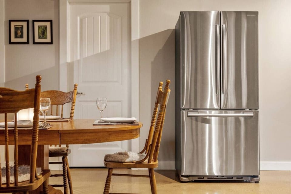 Dining/kitchenette with full-sized fridge and freezer.