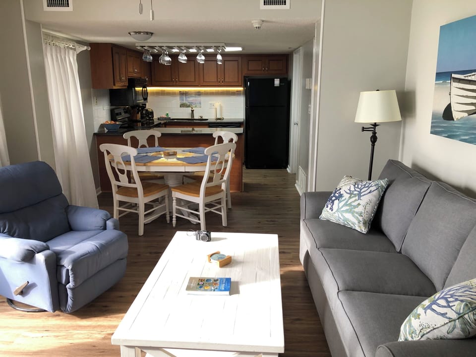 open concept living room dining area and kitchen