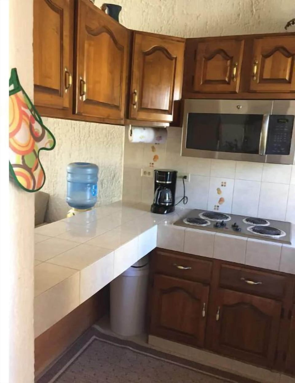 Kitchen is stocked for cozy meals in the condo