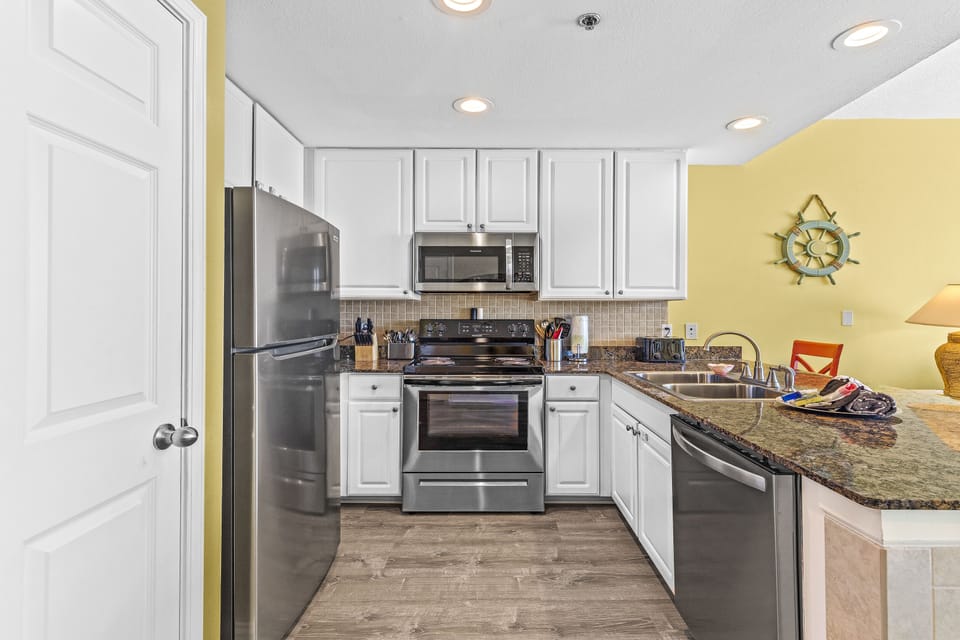 Prepare a meal in our kitchen, equipped with stainless steel appliances