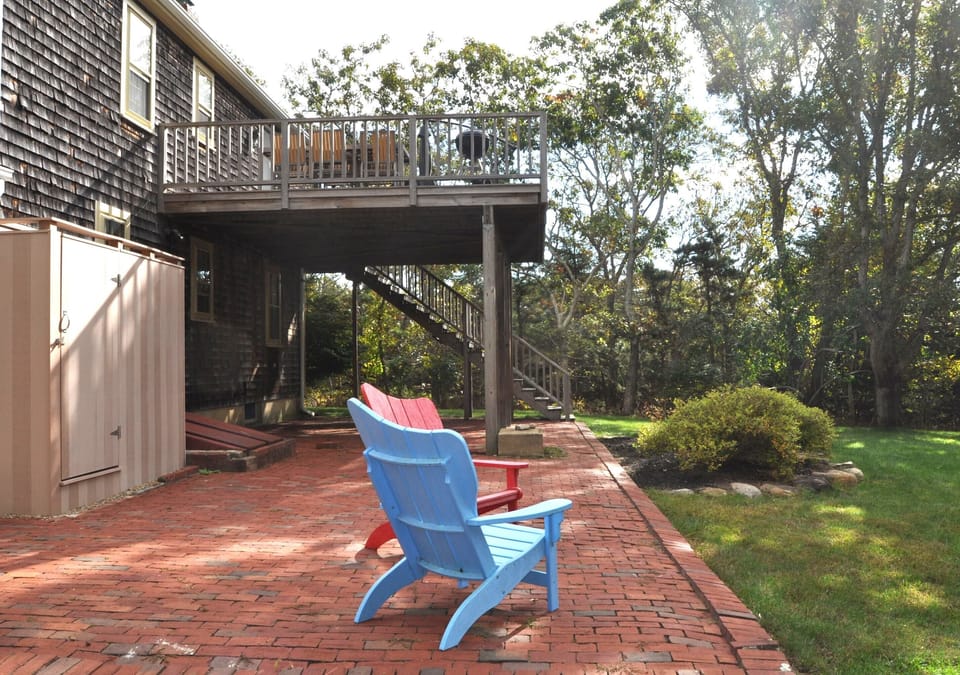 Outdoor shower off downstairs slider. Deck looking over large backyard.