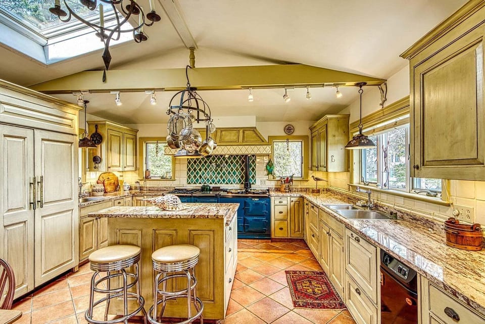 Kitchen from dining area. At left, Subzero fridge.   Beautiful cabinet work.