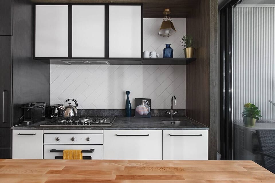 The kitchen is sleek and modern with everything you'll need to cook at home.