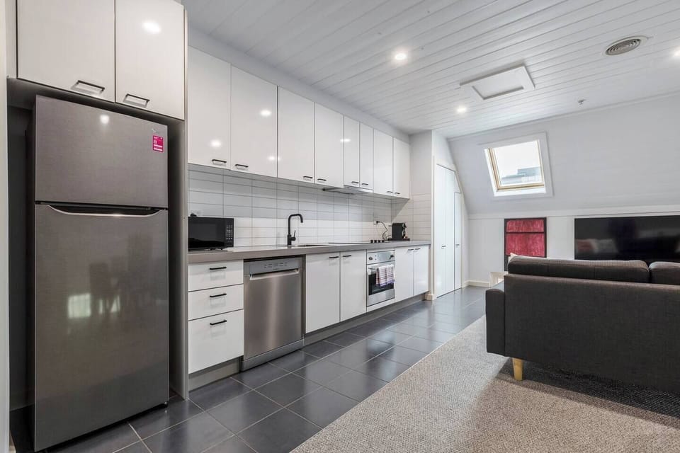The streamlined kitchen includes all you need to cook up some fresh produce from nearby Prahran Market. 
