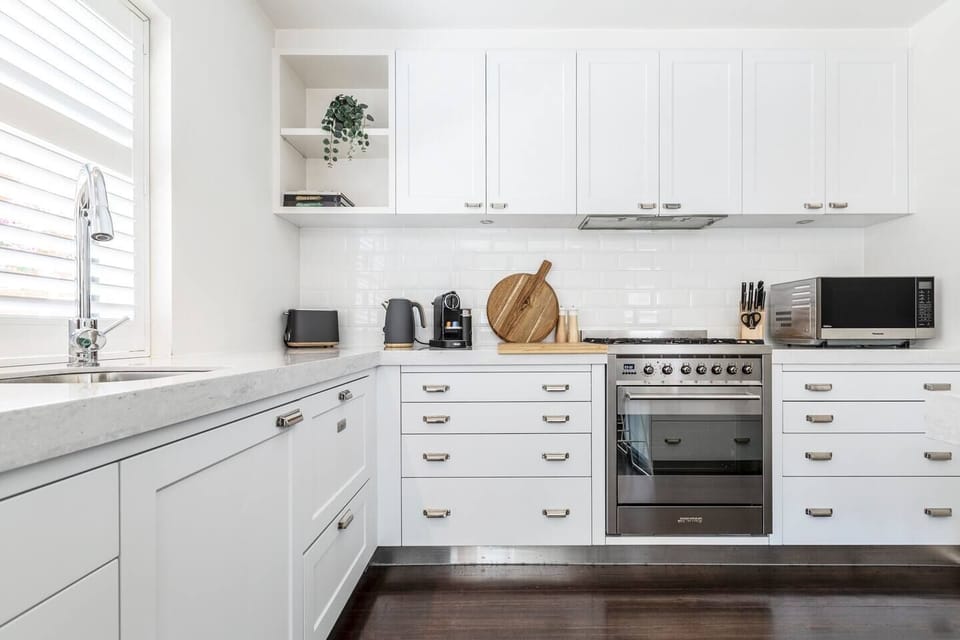 The stylishly appointed kitchen includes all you need to cook up some fresh produce from nearby Prahran Market. 
