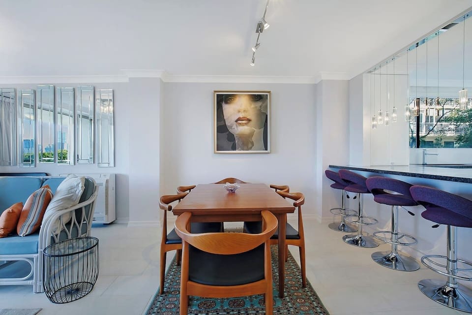 A large dining table makes it easy for guests to sit down to a meal at home.
