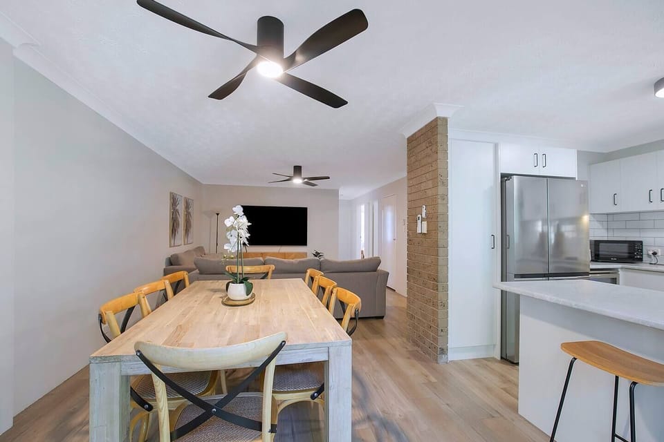 A seamless blend of style and functionality, the open-plan dining area flows effortlessly into the living room, creating the perfect space for shared meals and relaxed entertaining.
