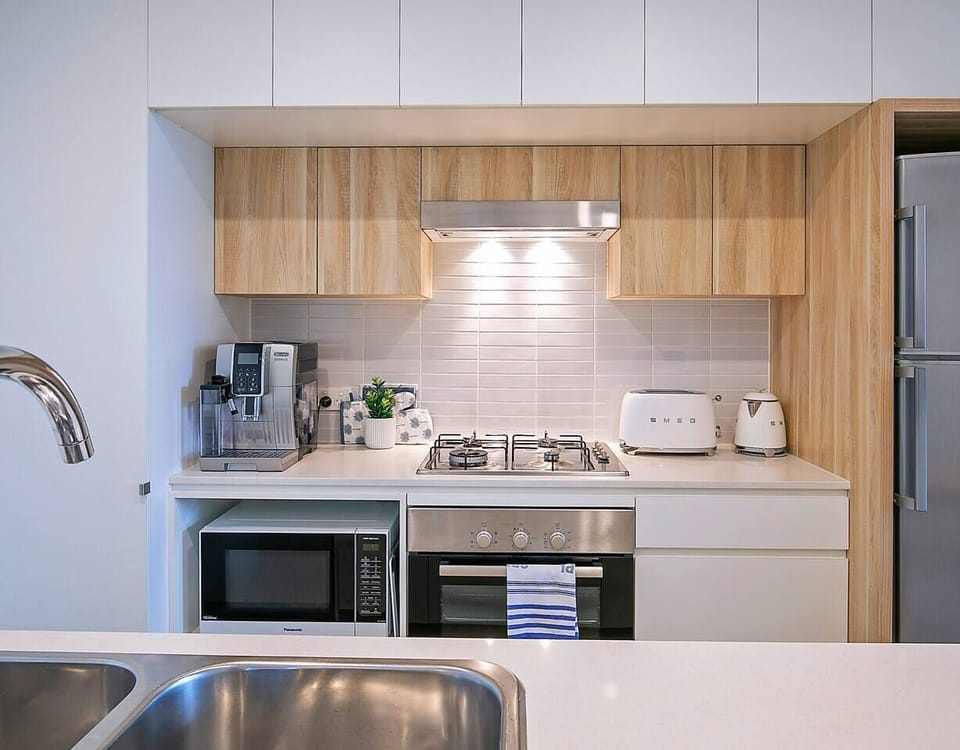 The kitchen has contemporary appliances for all your cooking desires. You’ll also enjoy the coffee machine for your morning brew. 
