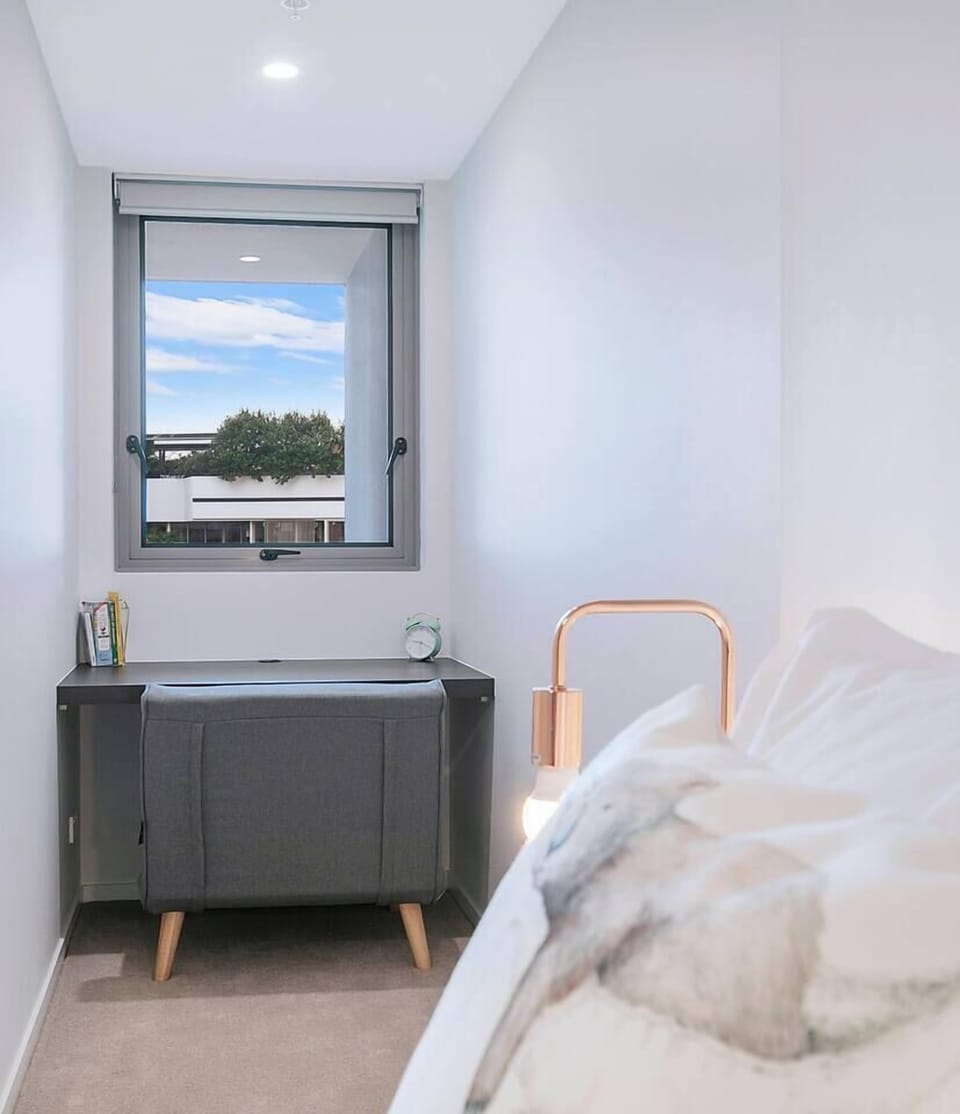 Find inspiration in your work from the cosy workspace, offering a delightful view through a small window.