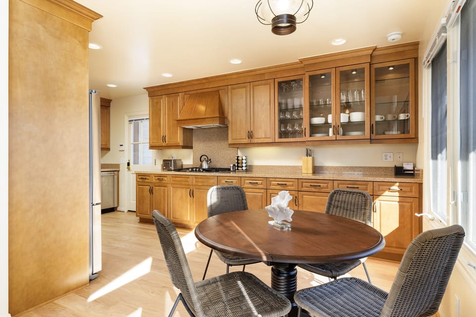 There is plenty of seating for all. This well equipped kitchen offers a great space to cook and enjoy meals.