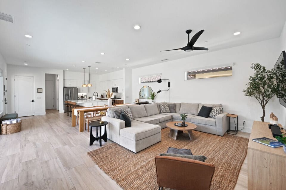 Open living space w/ plush seating flowing into the kitchen for easy group hangouts