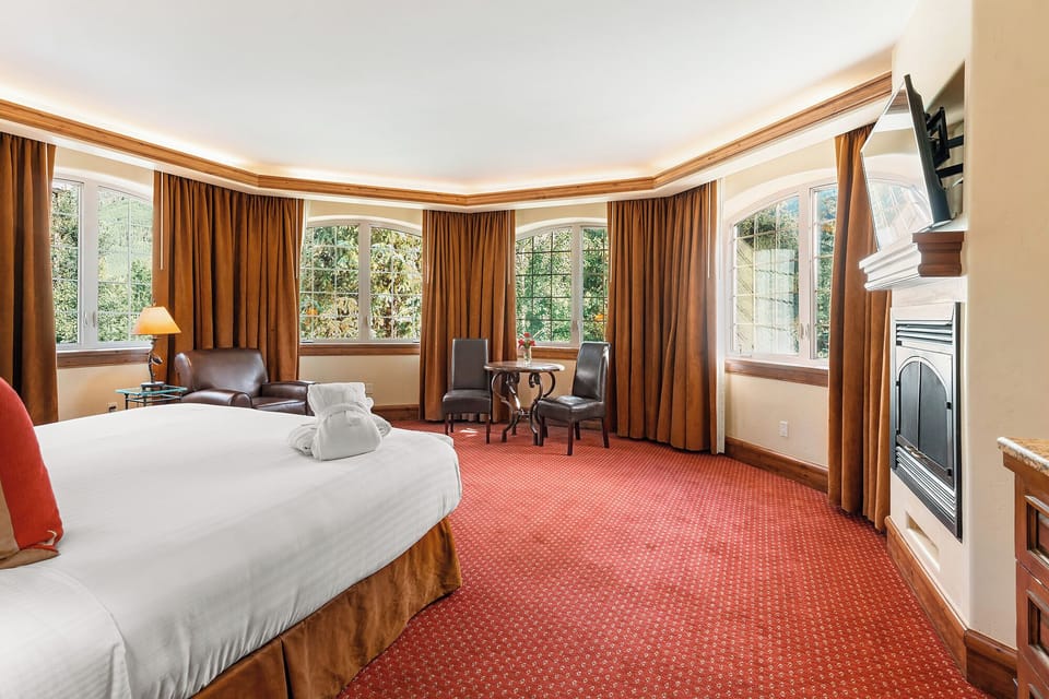 Unwind by the fireplace in a plush, spacious king bed.