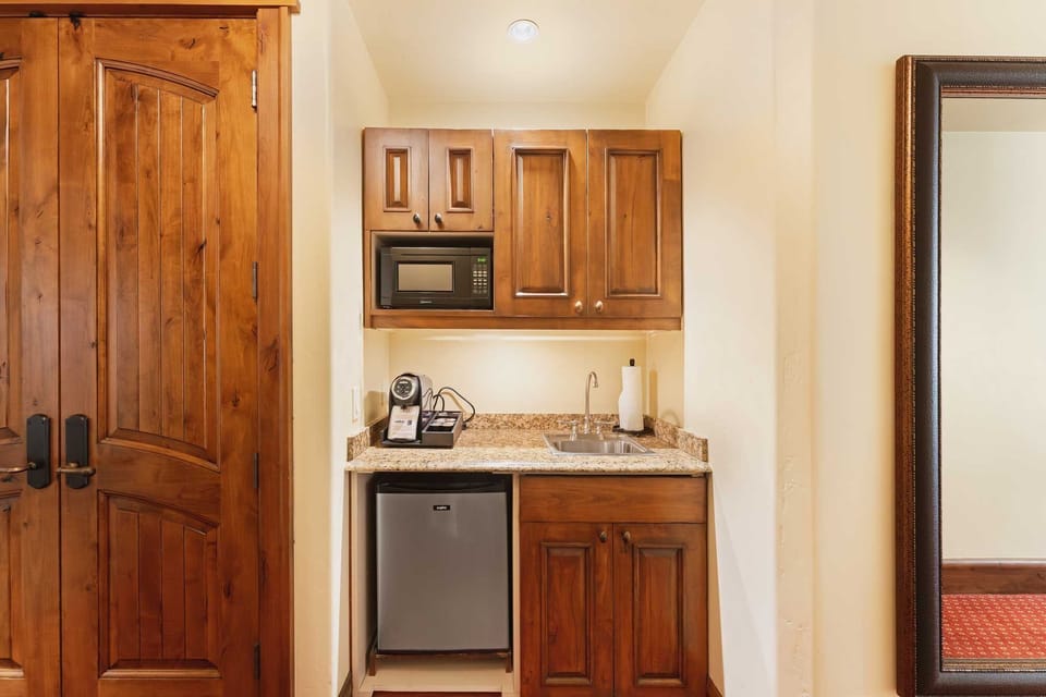 Sip coffee by wraparound windows in a calm, airy retreat.