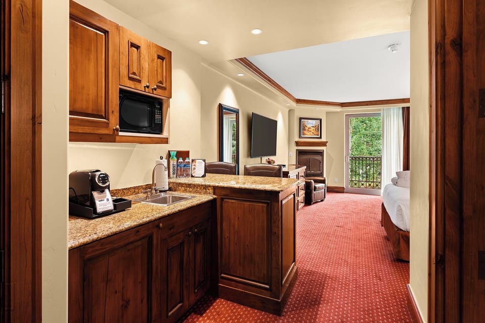 Step into your suite with kitchenette, seating, and sleeping area.