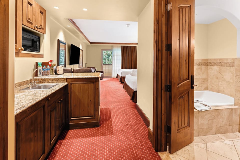 Start mornings easily with an in-room kitchenette and cozy beds.