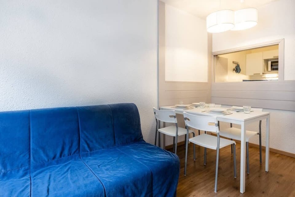 Double sofa bed, Dining table with space for 4 people. Kitchen behind 
