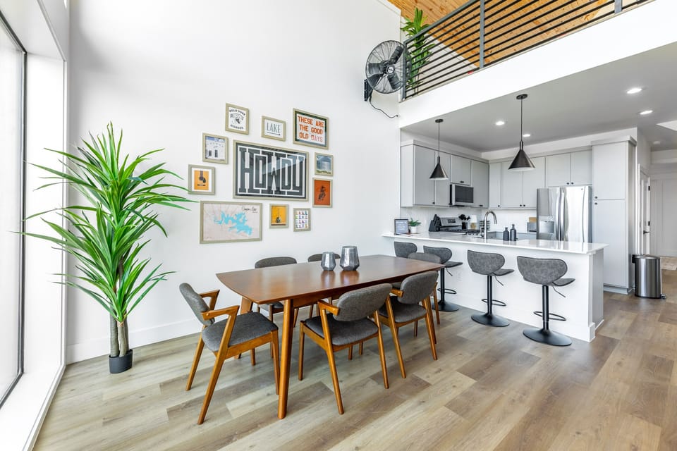 Dining room with seating for 6 and 4 additional seats at the kitchen counter. 
