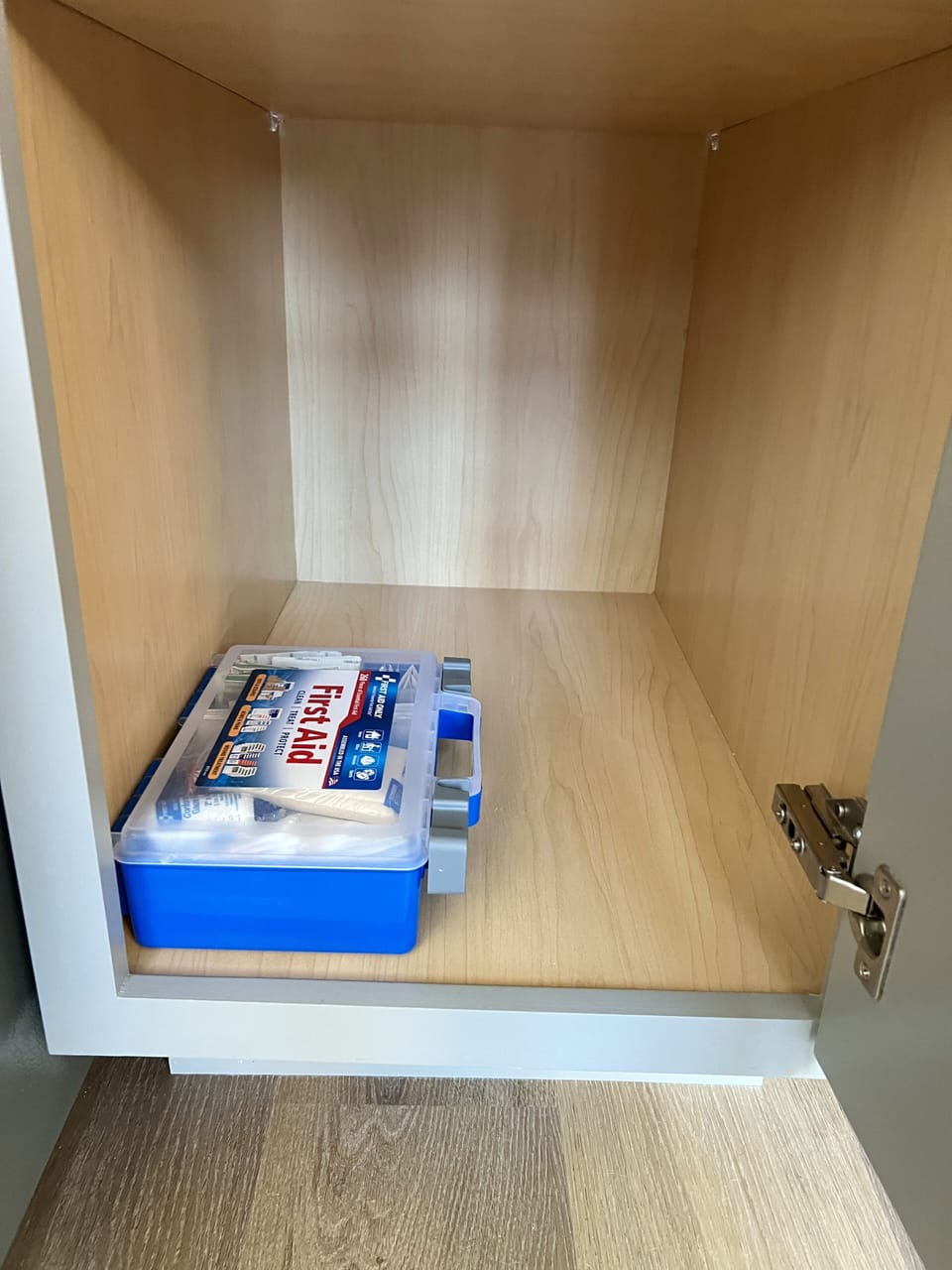 First aid kit in the kitchen.