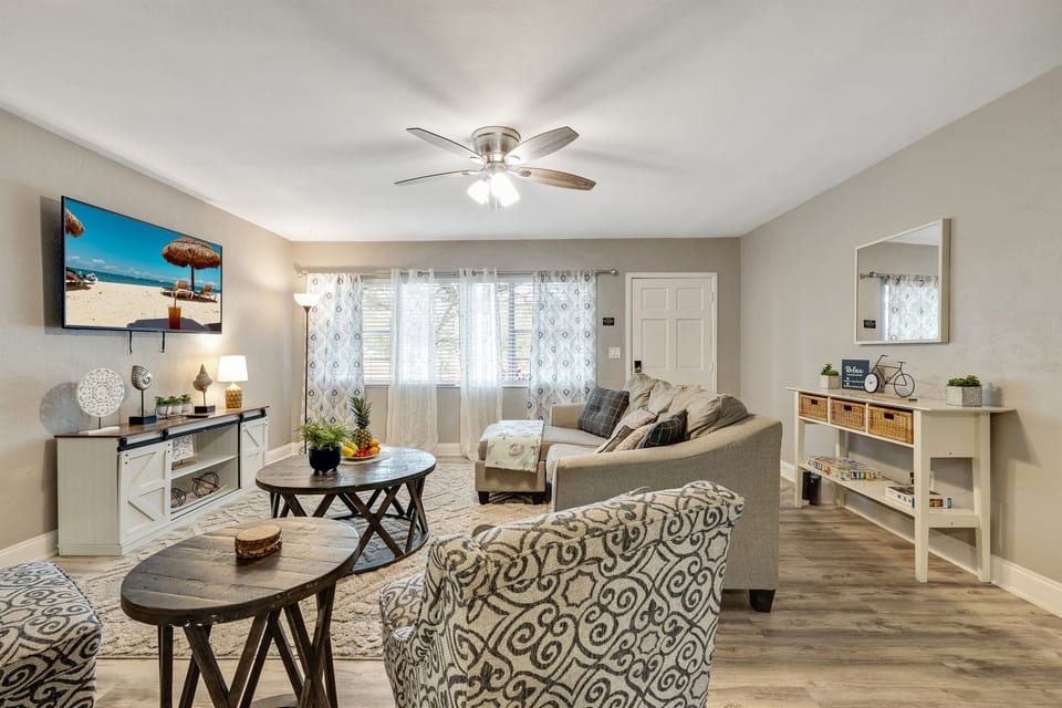 Bask in the natural glow from the expansive window, strategically placed to flood the living room with abundant natural light.