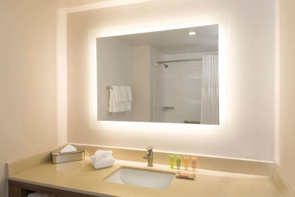 Rinse off comfortably with a bright shower and fresh towels.