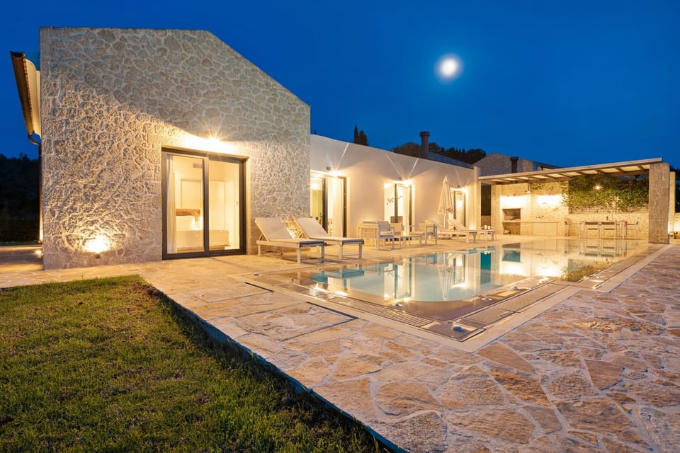 Night chilling%2Dout on a stone hued pool patio