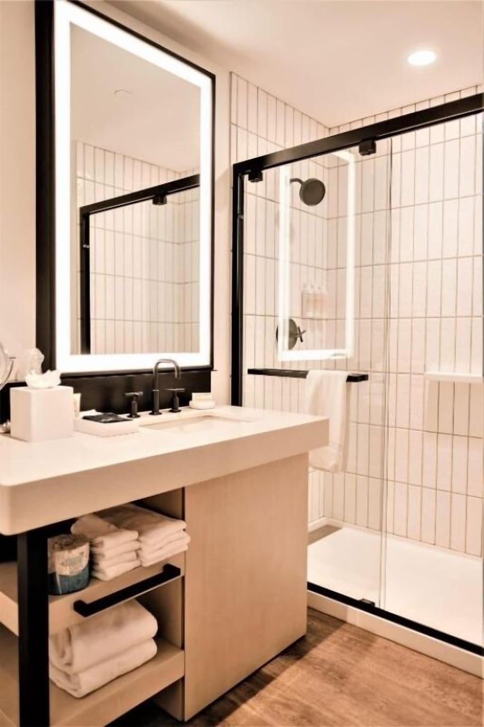 Indulge in a spa-bright vanity and glass-enclosed shower.